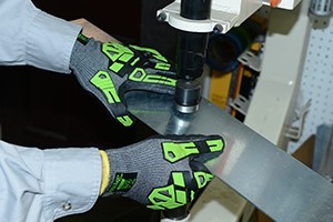 guy wearing gloves while working in a shop